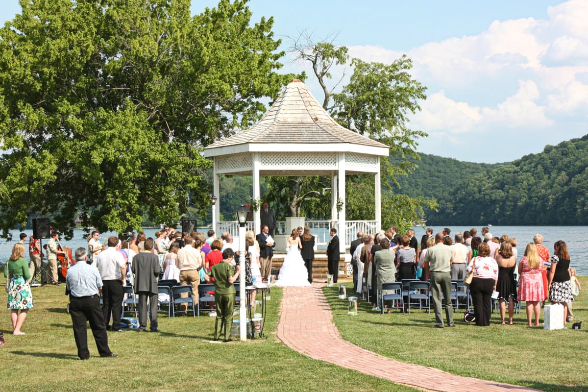 Outdoor wedding ceremony at Claytor Lake State Park with rustic lakeside setting suited to lawn-game reception planning
