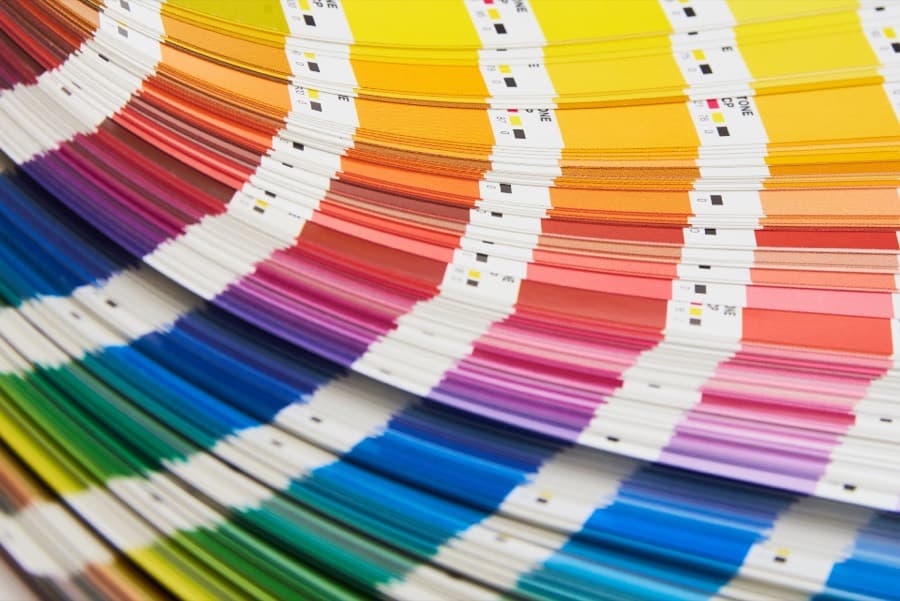 A fanned printing color swatch book used to match artwork colors before a board is printed